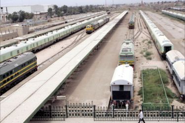 A man walks past the defunct trains at Baghdad Central Station, 17 May 2007.