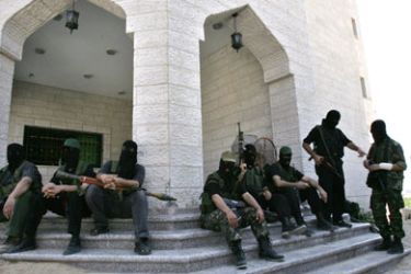 Hamas militants gather getting ready to deploy close to the pro-Fatah Preventative Security headquarters for the whole of the Gaza Strip in Gaza City,