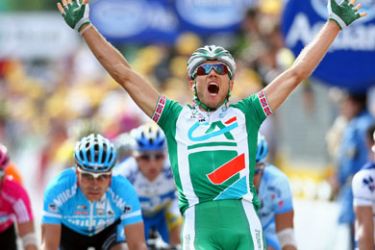 AFP/ Norway's Thor Hushovd (Credit Agricole/Fra) celebrates as he crosses the finish line of the fourth stage of the 94th Tour de France cycling race between Villers-Cotterets and Joigny, 11 July 2007