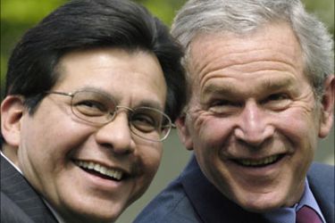r_U.S. President George W. Bush (R) and Attorney General Alberto Gonzales attend a celebration of the Cinco de Mayo holiday in the Rose Garden at the White House