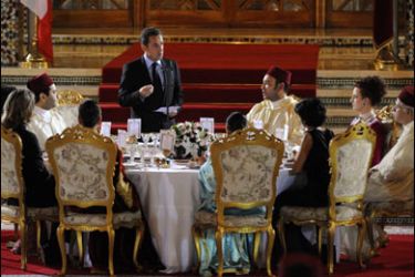 f/King of Morroco Mohamed VI listens to French President Nicolas Sarkozy delivering a speech at the Royal state diner at Marrakesh Royal Palace, 23 October 2007