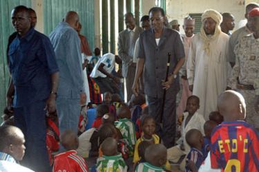 AFP/ This handout picture taken 26 October 2007 in Abeche and released by the Chad Presidency Press Office 28 October shows Chadian President Idriss Deby Itno (C) visiting children after the French charity Arche De Zoe (Zoe's Ark) tried to fly them from the central African nation to France.