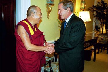 This file handout photo released by the White House 10 September, 2003 shows US President George W. Bush (R) welcoming the spiritual leader of Tibet, the Dalai Lama, to the White House