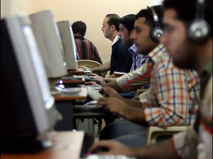 f/Iraqi youth surf the web at an internet cafe in Baghdad's impoverished district of Sadr city, 15 November 2007.