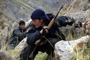 (FILES) File picture dated 18 November 2006 shows PKK guerillas storming a hilltop as they conduct military exercises in the mountains of northern Iraq's Kurdish autonomous region.