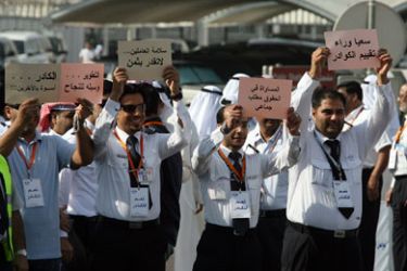 AFP/ Employees of Kuwaiti's Civil Aviation Labours Union stage a rare sit-in near Kuwait international airport (KIA) 19 November 2007. Kuwait air traffic was halted for almost an hour due to the strike, in which workers demanded higher salaries.