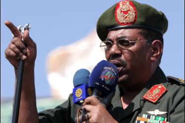 F/Sudanese President Omar al-Beshir speaks during a ceremony for the 18th anniversary of the national Public Defence Forces, 17 November 2007, in Madani. The United States has said it was "deeply troubled" by the government of Sudan's "foot-dragging and obstruction" on a joint UN-African Union peacekeeping force for strife-torn Darfur.