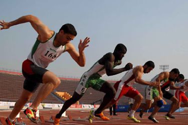 epa01180818 Athletes start the men's 100m running competition at the Athletics championships of the 11th Pan-Arab Games in Cairo, Egypt, 23 November 2007