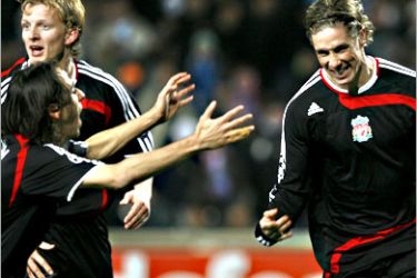 REUTERS/ Liverpool's Fernando Torres celebrates with team mates after scoring against Olympique Marseille during their Champions League Group A soccer match at the Velodrome stadium in Marseille December 11, 2007. REUTERS/Jean-