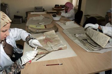AFPspecialists repair damaged manuscripts at the Iraqi National Library and Archives in Baghdad