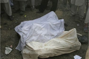 REUTERS/Bodies of victims are placed outside the office of a foreign aid agency,