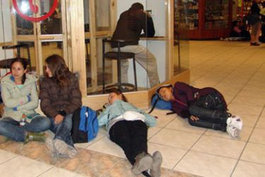 Tourists sleep on the floor of Cusco's airporrt in Peru