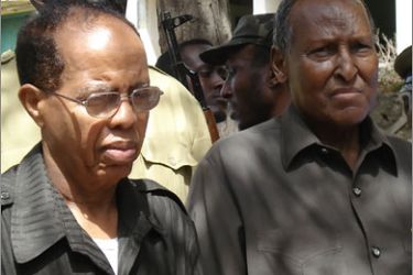 AFP Somali President Abdullahi Yusuf Ahmed (R) and his Prime Minister Nur Hassan Hussein attend the funeral of General Abdi Kahiye Farah