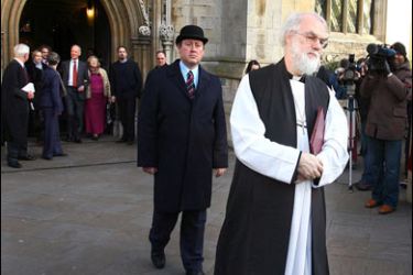 AFP PHOTO / The leader of the world's Anglicans, Archbishop of Canterbury Rowan Williams (C) leaves a memorial service at the Great St Mary's Church in Cambridge on February 9, 2008.