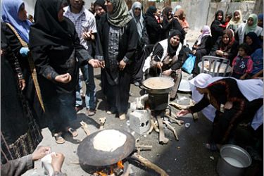 . AFP/ Palestinian women cook traditional food during celebrations marking the 60th anniversary of the "Nakba" (catastrophe) on May 12, 2008 in the Jabalia refugee camp, northern Gaza