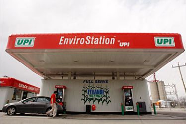 REUTERS/ A clerk attends to a customer at a UPI energy gas station in Chatham, Ontario, in this April 11, 2008 file photo. In the search for renewable energy, turning low-value materials like