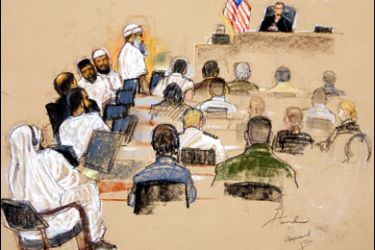 F/In this photograph of a sketch by courtroom artist Janet Hamlin, reviewed by the US Military, the September 11, 2001 attacks co-conspirator suspects, at left, attend their arraignment inside the war crimes courthouse at Camp Justice, the legal complex of the US Military Commissions, at Guantanamo Bay US Naval Base, in Cuba, on June 5, 2008