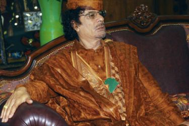R/ Libyan leader Muammar Gaddafi attends a meeting with Benin President Yayi Boni in Cotonou during the summit of heads of state of Community of Sahel-Saharan States (CEN SAD) June 17, 2008.