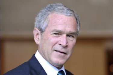 f/US President George W.Bush jokes as he as he arrives for the G8 Summit at the Windsor Hotel Toya in Toyako on July 7, 2008.