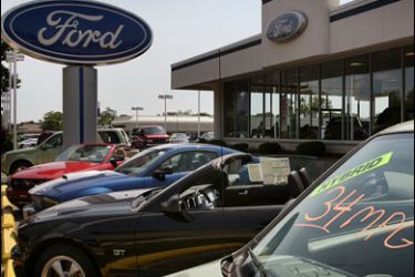 AFP PHOTO/Ford vehicles sit on the lot of a new-car dealership on July 1, 2008 in Glenview, Illinois. Ford Motor Co. said it sales fell nearly 28 percent in June.