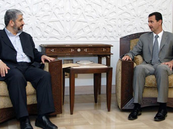 F/A handout picture released by the Syrian Arab News Agency (SANA) shows Syrian President Bashar al-Assad (R) speaking with exiled Palestinian Hamas leader Khaled Meshaal during a meeting in Damascus on July 3, 2008.