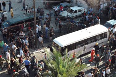 Lebanese people gather at the site of a roadside bomb in central Tripoli in northern Lebanon on August 13, 2008