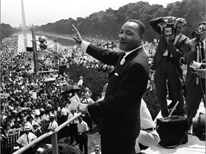 AFP(FILES)The civil rights leader Martin Luther King (C) waves to supporters in this 28 August 1963 file photo on the Mall in Washington DC (Washington Monument in background)