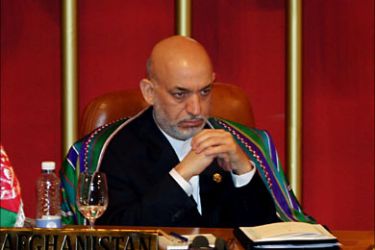 f_Afghan President Hamid Karzai looks on during the opening ceremony of the South Asian Assocation for Regional Cooperation (SAARC) Summit in Colombo on August