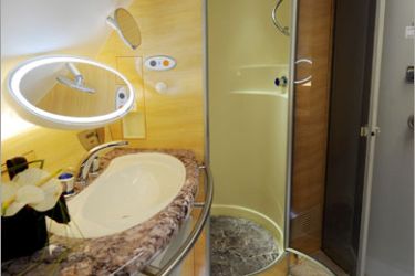 AFP / A shower in the first class bathroom aboard an Emirates Airlines A380 on August 1, 2008. Emirates becomes the first commercial Airbus A380 jet to land in the United States at