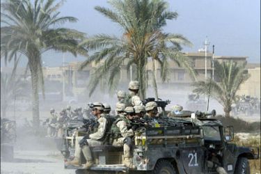 afp : (FILES)--US soldiers from the 82nd Airborne division secure an area during a search for a weapons cache in Fallujah, 50 kms (30 miles) west of Baghdad, 07 November