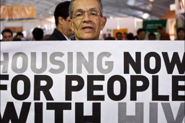 afp : An HIV patient holds a sign during a demonstration at the Global Village in Mexico City on August 5, 2008, in the framework of the XVII International AIDS/HIV Conference.