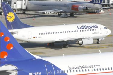 AFP (FILES) Two airplanes, one of Brussels Airlines and the other Lufthansa (C) sit on the tarmac at Brussels International Airport in Zaventem, on February 8, 2008. German airline