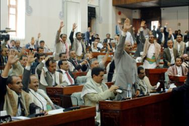 afp : Lawmakers at the Yemeni house of representatives or parliament raise their hands during voting on a new election law in Sanaa on August 18, 2008. The Yemeni parliament