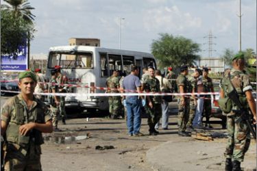 Lebanese security forces gather at the site of an explosion in the northern Lebanese port city of Tripoli on September 29, 2008.