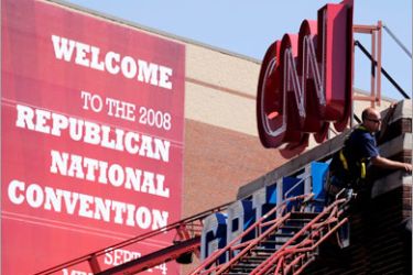 epa01471937 A workman secures the CNN Grill sign outside the Xcel Energy Center in St. Paul, Minnesota, USA, 30 August 2008. The Republican National Convention is
