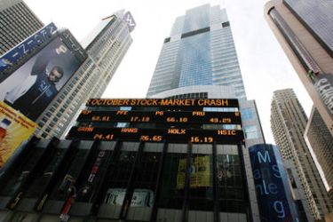 A stock ticker is seen on the outside of the Morgan Stanley building in New York,
