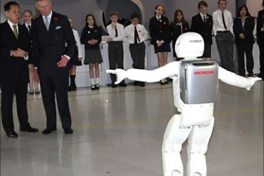 r_Britain's Prince Charles looks at Honda's humanoid robot "Asimo" at the National Museum Of Emerging Science And Innovation in Tokyo October 28, 2008.