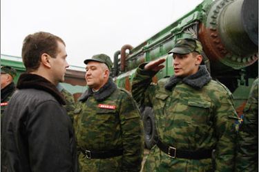 AFPRussian President Dmitry Medvedev speaks with officers near RS-12M Topol ballistic missiles at the Plesetsk space lunch pad