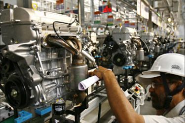 r_An employee works inside Maruti Suzuki's newly launched petrol engine plant on the outskirts of New Delhi October 21, 2008