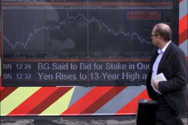 afp : A man walks past an electronic display board showing the FTSE 100 share index in London on October 24, 2008. Stock markets crashed Friday amid shock at mounting