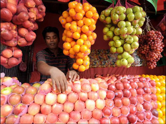 f/A vendor sells imported fruits in the Sri Lankan capital of Colombo on November 11, 2008.