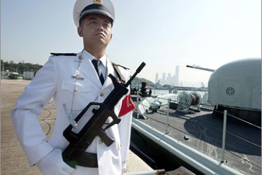 AFP (FILES) Photo taken November 25, 2008 shows a Chinese People's Liberation Army (PLA) naval troop standing guard during the city's annual rotation of military personnel,