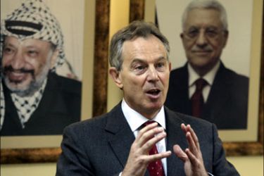 afp : Middle East peace envoy Tony Blair gestures during a meeting with Palestinian Prime Minister Salam Fayad (unseen) in the West Bank city of Ramallah on January 25,