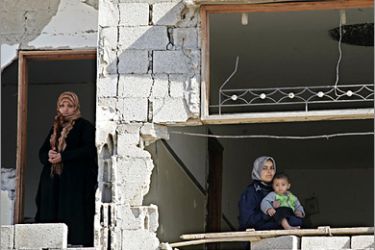 . AFP - Palestinian women inspect a building that was destroyed during Israel’s 22-days offensive in the Gaza Strip on February 02, 2009 in Rafah, southern Gaza. Israel carried