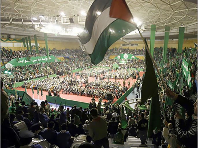 AFP - A Palestinian Hamas supporter waves his national flag as humdreds others attend a rally at a stadium in Beirut on February 1, 2009 to celebrate the Islamist
