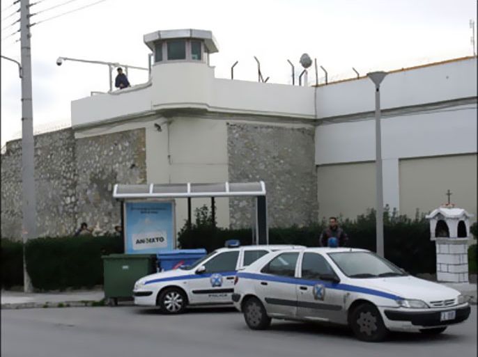 afp : Policemen stand guard around the Korydalos prison area after serial armed robber and kidnapper Vassilis Paleocostas with his Albanian sidekick Alket Rizai staged a