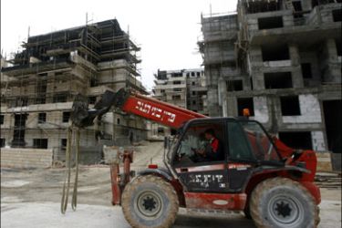 afp ; Palestinian laborers work at a construction site in the West Bank Jewish settlement of Maale Adumim near Jerusalem on March 2, 2009. Israel's housing ministry has