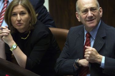 afp/ Outgoing Israeli Prime Minister Ehud Olmert (R) and Foreign Minister Tzipi Livni attend a Knesset (Israeli Parliament) session commemorating the 30th anniversary of the Israeli-Egyptian peace treaty on March 30, 2009 in Jerusalem.