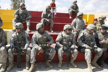 afp/ US soldiers watch a football match following the inauguration of the newly opened football field during the transfer of authority of the Shulla Joint Security Station from the US 1st Battalion,18th Infantry Regiment to the 2nd Battalion, 22nd Brigade, 6th Iraqi Army Division in Baghdad on March 02 2009.
