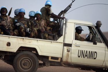 R/ Nigerian peacekeeping soldiers from the United Nations-African Union Mission in Darfur (UNAMID) patrol in Osha IDP's camp in Nyla, southern Darfur March 17,2009.